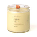 Candle in a glass jar labeled 'Peace' on a white background