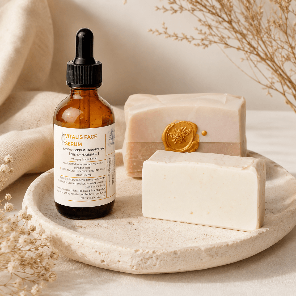 Bottle of face serum with two soap bars on a stone surface